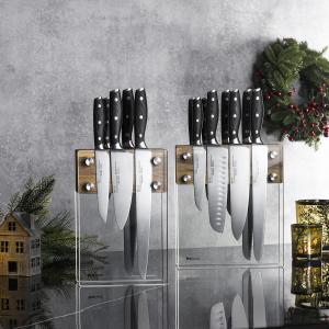 Shiny set of kitchen knives with Christmas decorations