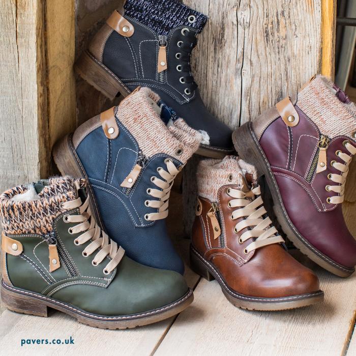 Pile of warm autumn boots in muted colours