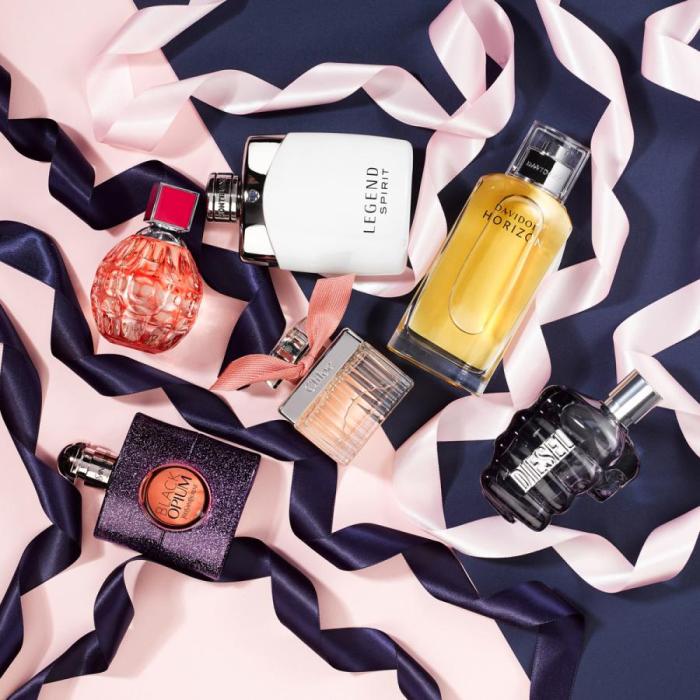 Perfume flatlay with ribbons